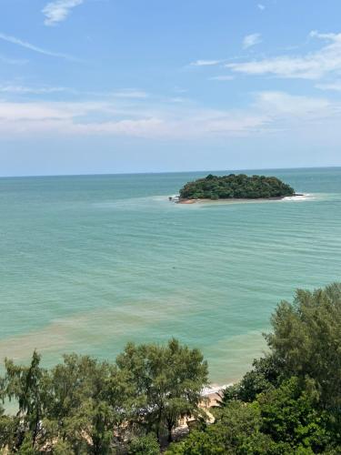 an island in the middle of the ocean with trees at D'Wharf Hotel & Serviced Residence in Port Dickson
