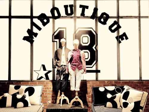 a man and a woman standing in front of a window at M Boutique Hotel Station 18 - Ipoh in Ipoh