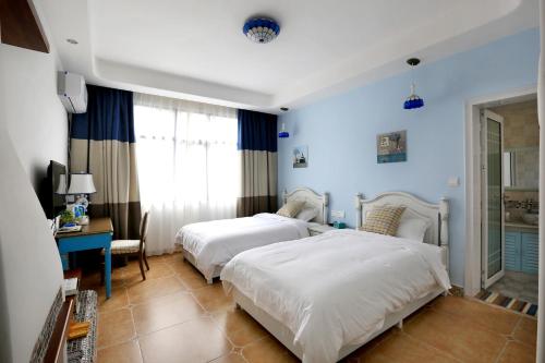Cama o camas de una habitación en Yijingju Humanistic Inn