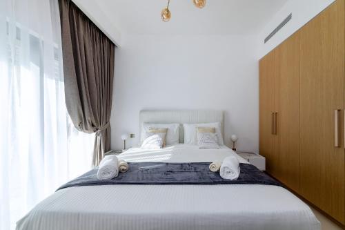Postel nebo postele na pokoji v ubytování Wonderful Apartments in Icon Bay