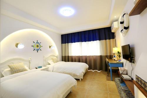 Cama o camas de una habitación en Yijingju Humanistic Inn