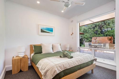 Ένα ή περισσότερα κρεβάτια σε δωμάτιο στο Frankies Beach House family and pet friendly