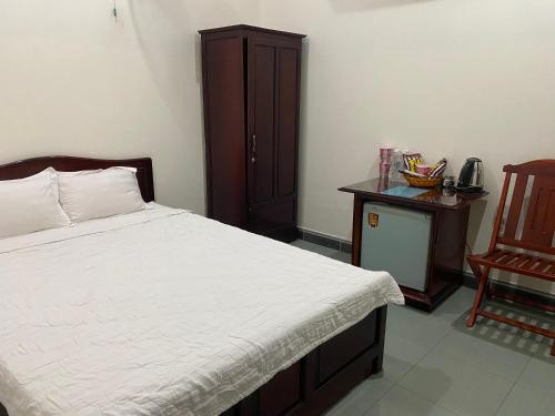 Una cama o camas en una habitación de Cát Tường Hotel