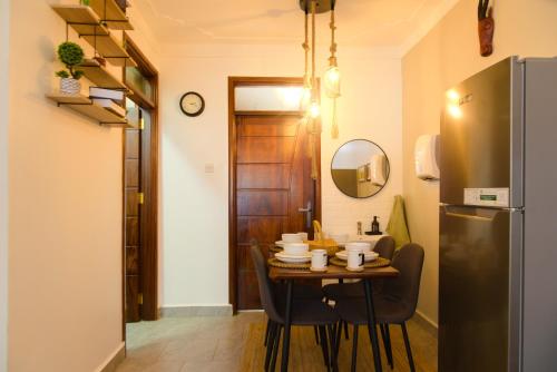 Kuchyň nebo kuchyňský kout v ubytování Gamaleo Apartments Namulanda