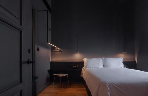 Ένα ή περισσότερα κρεβάτια σε δωμάτιο στο The Sendal Boutique Hotel