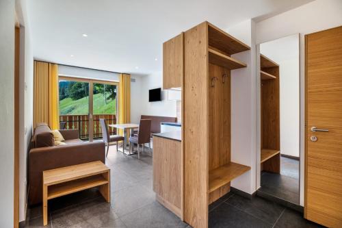 a living room with a couch and a table at Bachwiesl Hof Apt Gonn in Proves