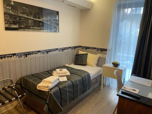 Postel nebo postele na pokoji v ubytování Hotel Corsten