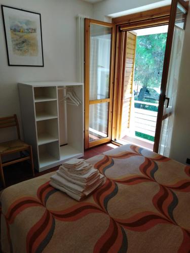 a bedroom with a bed and a large window at Raggio Di Sole in Alberobello