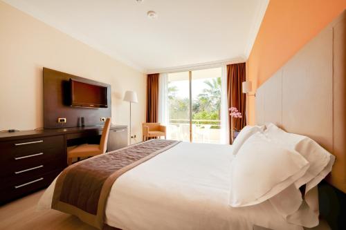 Nyala Suite Hotel tesisinde bir odada yatak veya yataklar