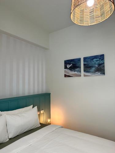 Postel nebo postele na pokoji v ubytování WinXin House