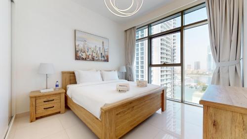 Postel nebo postele na pokoji v ubytování Primestay - Beach Vista 1 1BR in Dubai Harbour