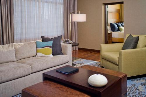 a living room with a couch and a coffee table at Grand Hyatt Denver in Denver