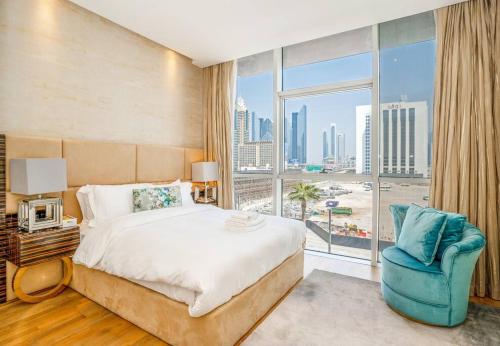 a bedroom with a bed and a large window at Fully Furnished 3BR+ Maid’s in the heart of Dubai in Dubai