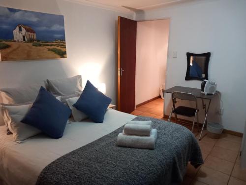 Postel nebo postele na pokoji v ubytování 19 On Kruger Apartments