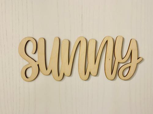 a sign that says sunny hanging on a wall at AnNa Home & Sunny Home Apartments in Karlsruhe