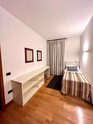 Ένα ή περισσότερα κρεβάτια σε δωμάτιο στο Palazzo Brando - Living Apartments