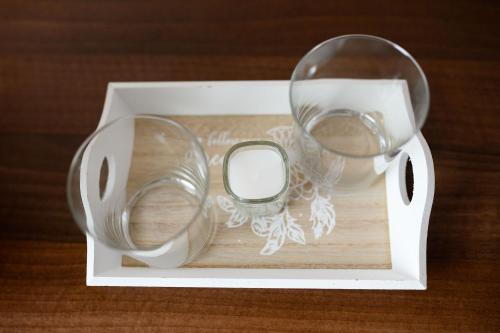 a white box with two glasses and a mirror at Pensiunea Irish in Mediaş