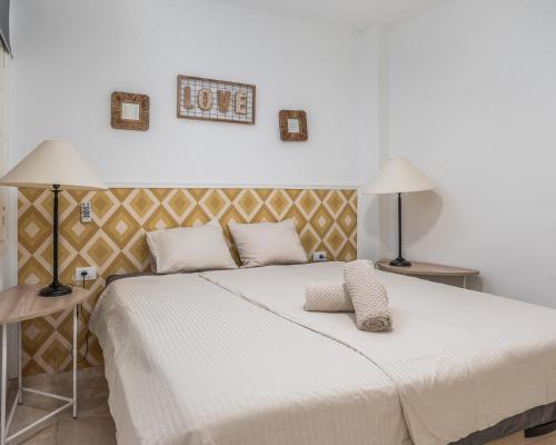 A bed or beds in a room at Los Gigantes apartamento de 3 habitaciones