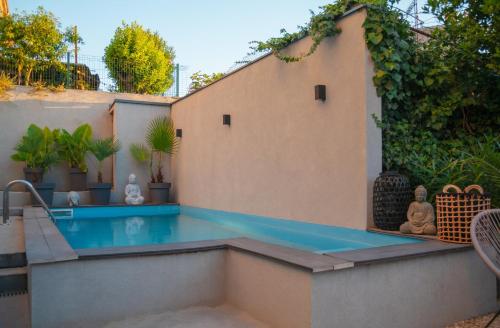 a swimming pool in the backyard of a house at Captain Emo City Apartments in Pula