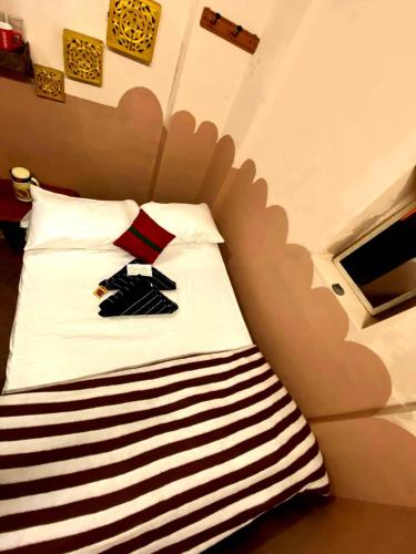 Una cama o camas en una habitación de Stay Inn Heritage