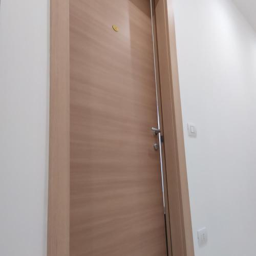 a wooden door in a room at STRADONE 132 in Gravina in Puglia