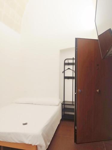 a bedroom with a bunk bed and a ladder at STRADONE 132 in Gravina in Puglia