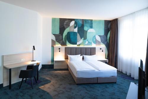 Postel nebo postele na pokoji v ubytování Taste Hotel Kulmbach