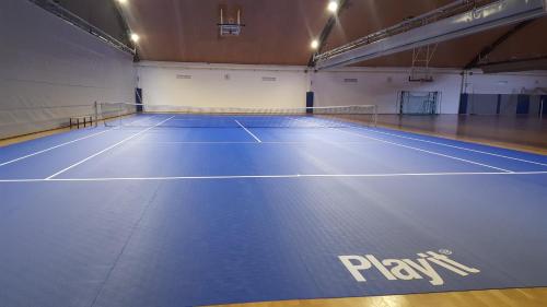a tennis court with the words play on it at GO! Sport hotel & resort in Rogaška Slatina