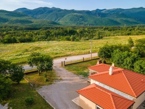 an aerial view of a house with an orange roof at House Family Podhum in Dražice