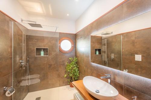 a bathroom with a sink and a shower at Maison Desiderio in Sorrento