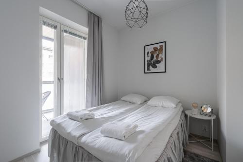 Postel nebo postele na pokoji v ubytování 2ndhomes Tampere "Pikku Aleksi" - Apartment with Best Location & Balcony