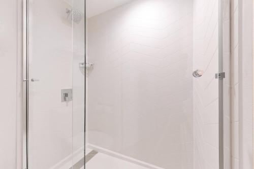 a shower with a glass door in a bathroom at Fairfield Inn and Suites by Marriott Bakersfield Central in Bakersfield
