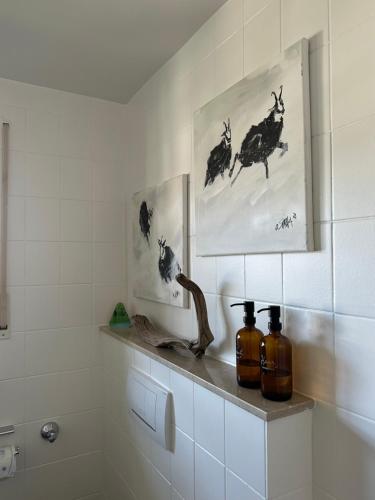 a bathroom with two bottles sitting on a shelf at annes*glück in Füssen