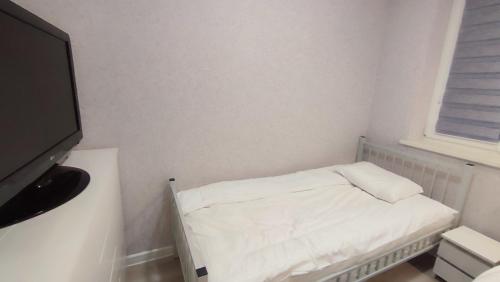 Postel nebo postele na pokoji v ubytování Apartamenty Tuwima
