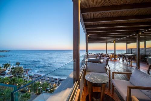 a view of the ocean from the balcony of a resort at AKASHA Beach Hotel & Spa in Hersonissos