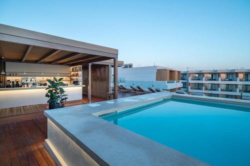 a swimming pool on the roof of a building at AKASHA Beach Hotel & Spa in Hersonissos