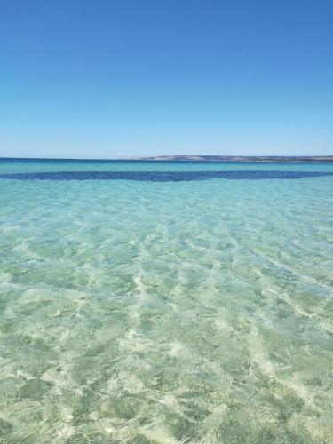 a view of the clear blue water in the ocean at Strandmarken in Island Beach
