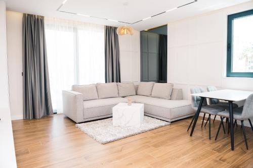 a living room with a couch and a table at Hotel Teuta in Ulcinj