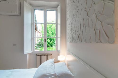 Postel nebo postele na pokoji v ubytování Giuliny Lovely Flat - The House Of Travelers