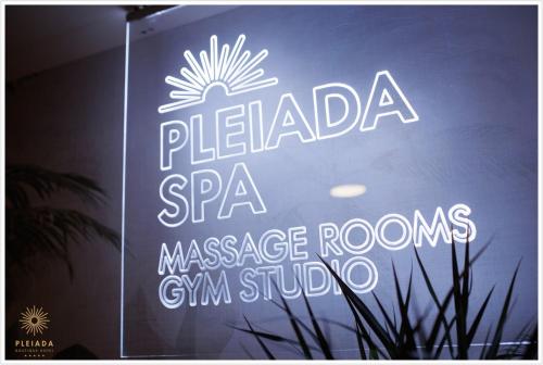 a neon sign on the window of a restaurant at Pleiada Boutique Hotel & Spa in Iaşi