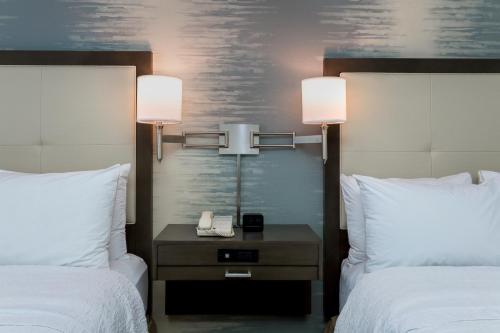 a hotel room with two beds and a table with a phone at Hampton Inn & Suites San Diego-Poway in Poway