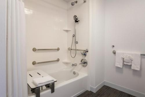a bathroom with a bath tub and a sink at Hampton Inn & Suites San Diego-Poway in Poway