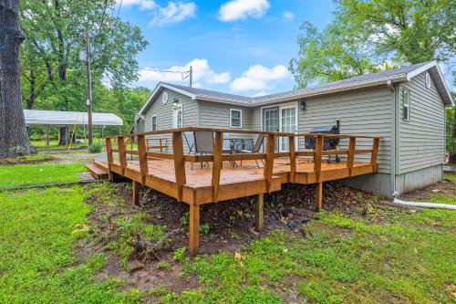 a large wooden deck in front of a house at Eternal Sunrises in Sunrise Beach