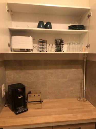 a kitchen with a counter with a coffee maker on it at Eine 2 Zimmer Ferienwohnung Münster City in Münster