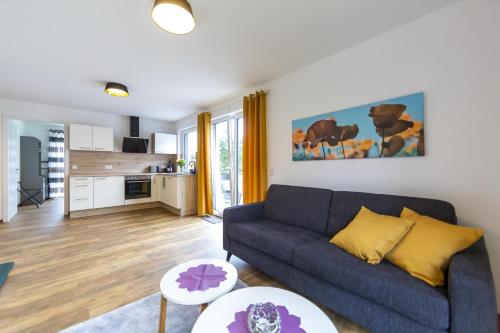 a living room with a couch and a table at Ferienwohnungen Rhönhimmel in Gersfeld