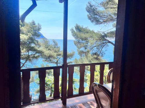 a room with a view of the ocean from a balcony at Villaggio Smeraldo in Moneglia