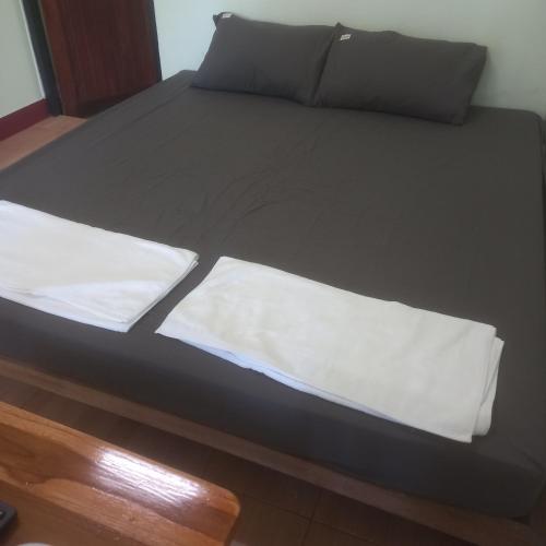 Ένα ή περισσότερα κρεβάτια σε δωμάτιο στο บ้านอิ่มเอม