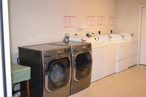a washer and dryer in a laundry room at Eastside Suites in Lynchburg
