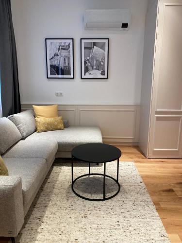 a living room with a couch and a table at Hotel Gasthof König in Kremsmünster