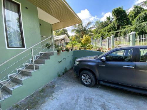 a car parked in front of a house at Lucia’s Place in Tanauan